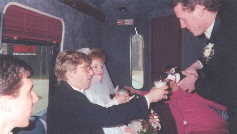 The Wedding Party Celebrating in the Wedding Coach